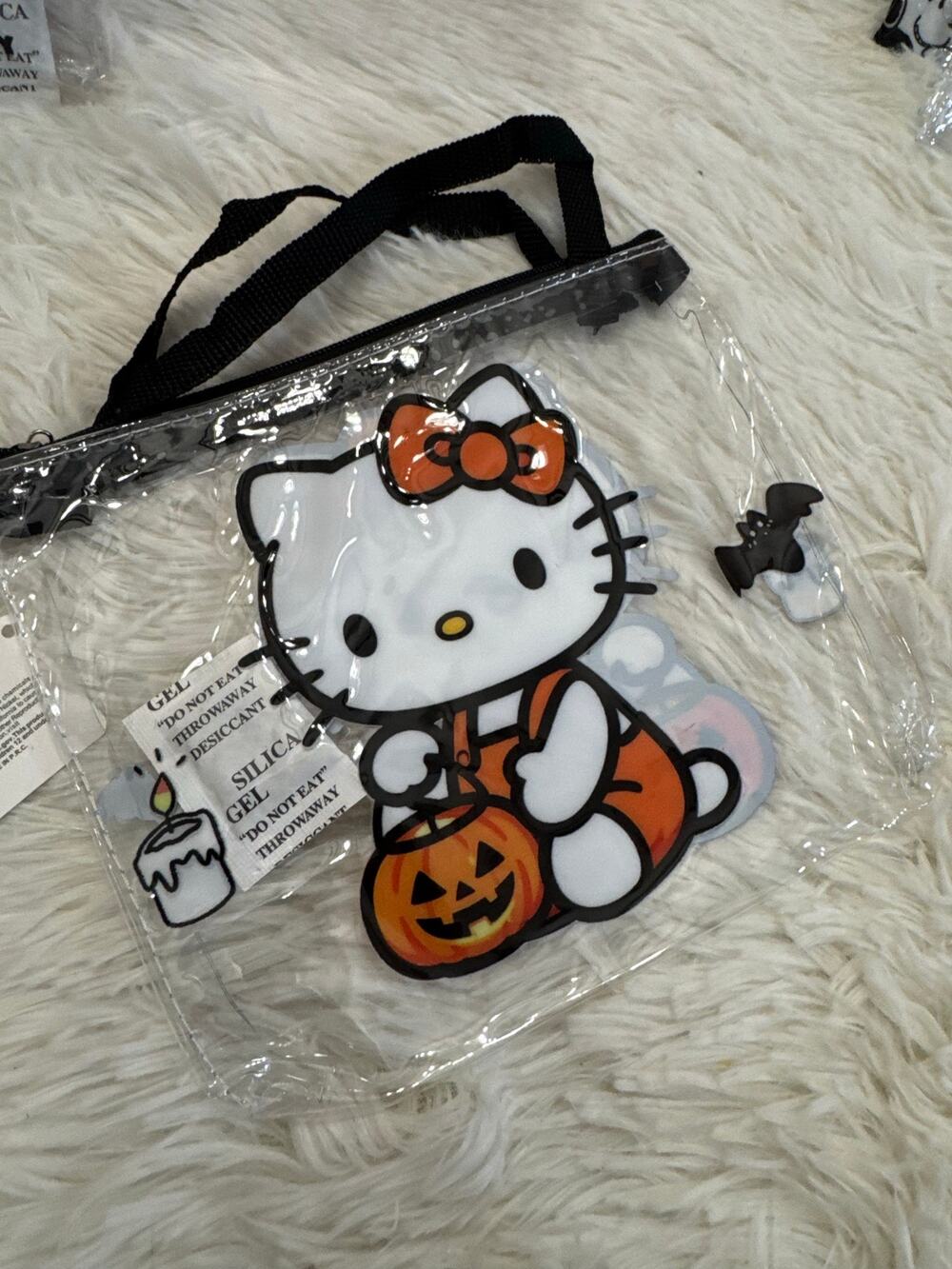 Hello Kitty Halloween clear pouch bag with Hello Kitty holding a pumpkin